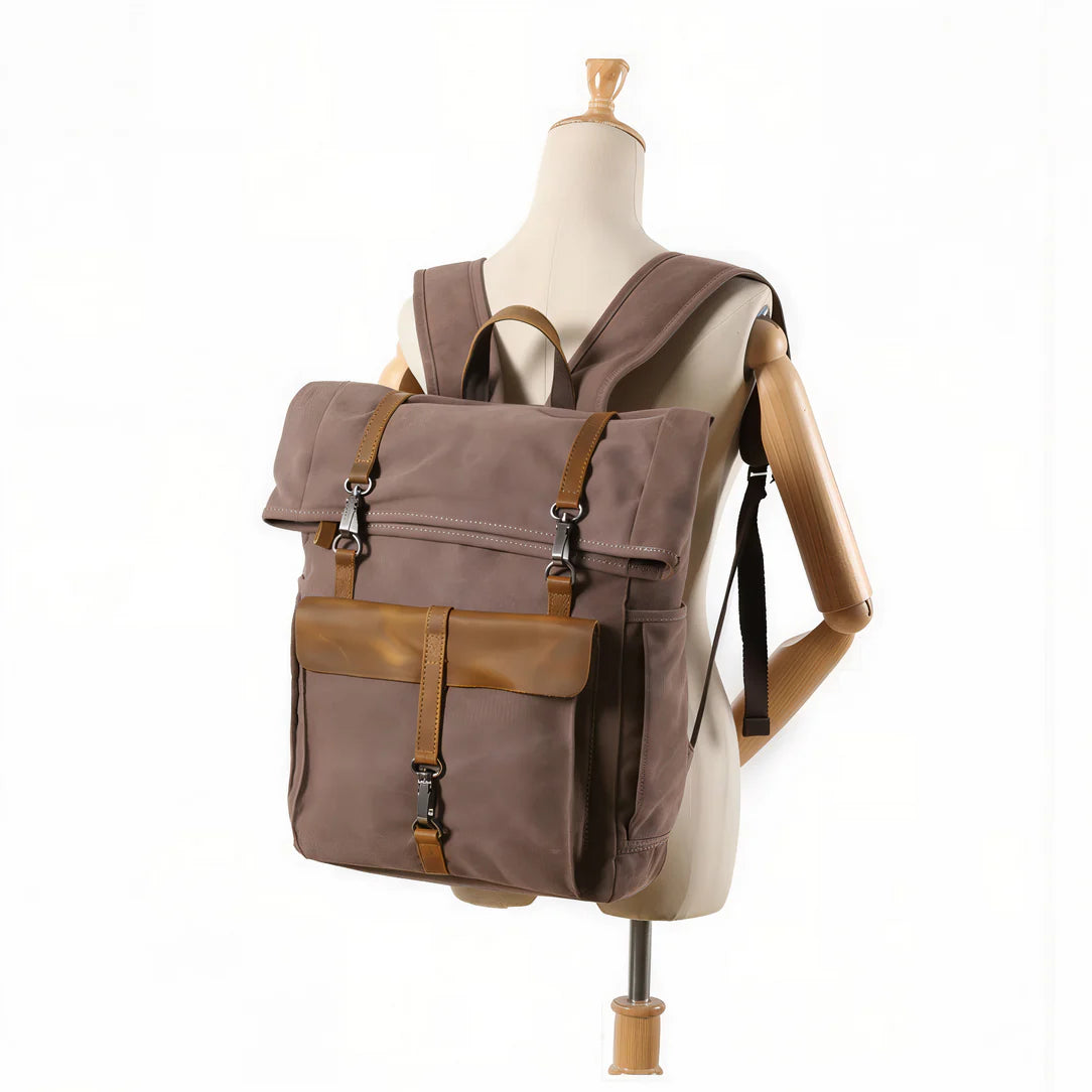 Sac à dos vintage taupe en toile avec accents en cuir marron et ferrures argentées