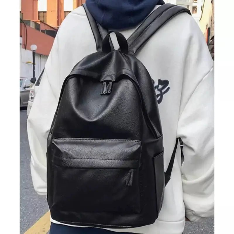 Sac à dos ville homme cuir en faux cuir noir avec poches avant et latérales