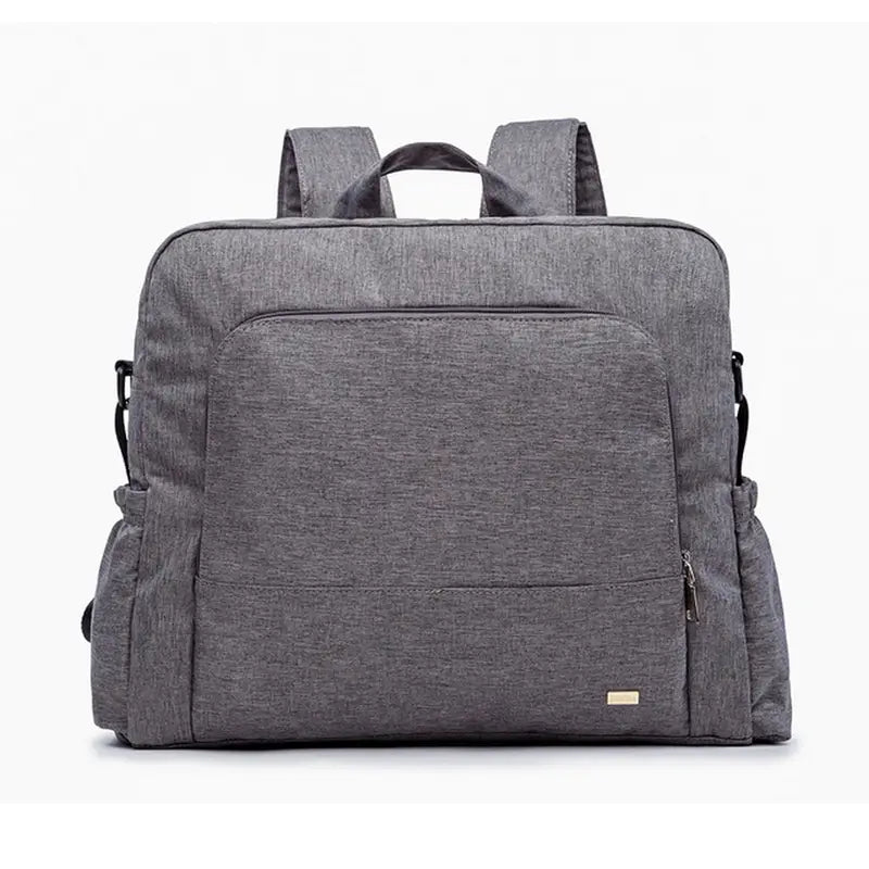 Sac à langer à dos en tissu gris chiné avec multiples poches et bretelles