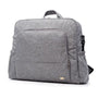 Sac à langer à dos en tissu gris avec multiples poches et poignée supérieure