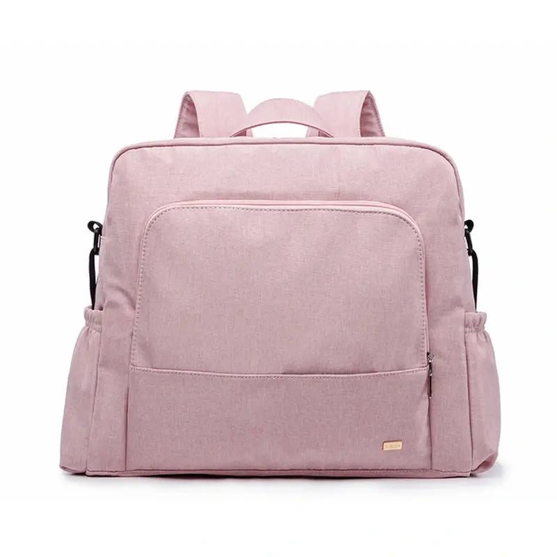 Sac à langer à dos rose clair avec plusieurs poches et bretelles confortables