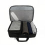 Sac de voyage MoveCase I ouvert avec poche en filet, petite organizer et vêtements roulés