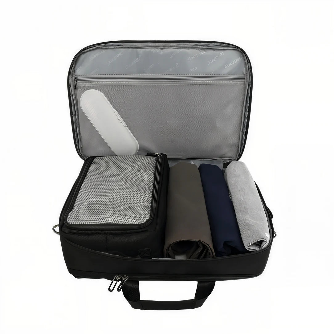 Sac de voyage MoveCase I ouvert avec poche en filet, petite organizer et vêtements roulés