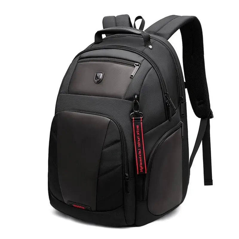 Sac ordinateur grande taille noir avec plusieurs compartiments et une sangle porte-clés rouge